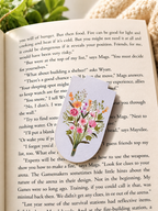 Wildflower magnetic bookmark placed on open book creating soft reading aesthetic