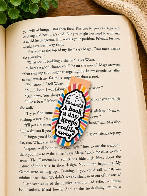 Magnetic bookmark with reading quote placed inside an open book in a cosy reading setting