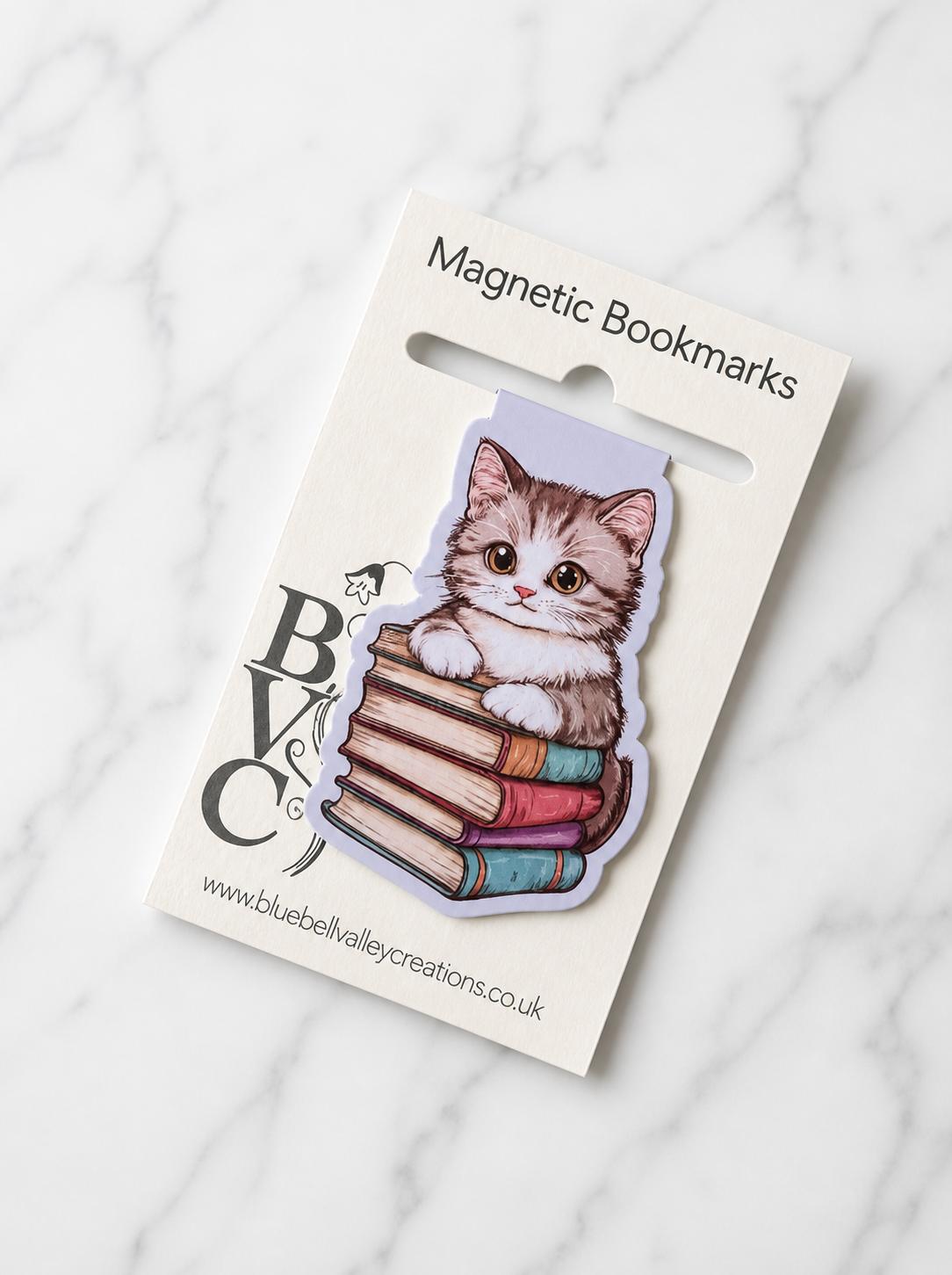 Cute kitten bookmark displayed on branded packaging card