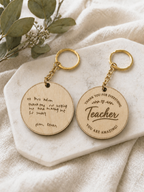 Personalised wooden teacher keychain displayed on neutral fabric background as a thoughtful thank you gift