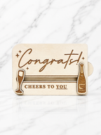 Laser engraved wooden congratulations gift card holder with champagne bottle and glass design