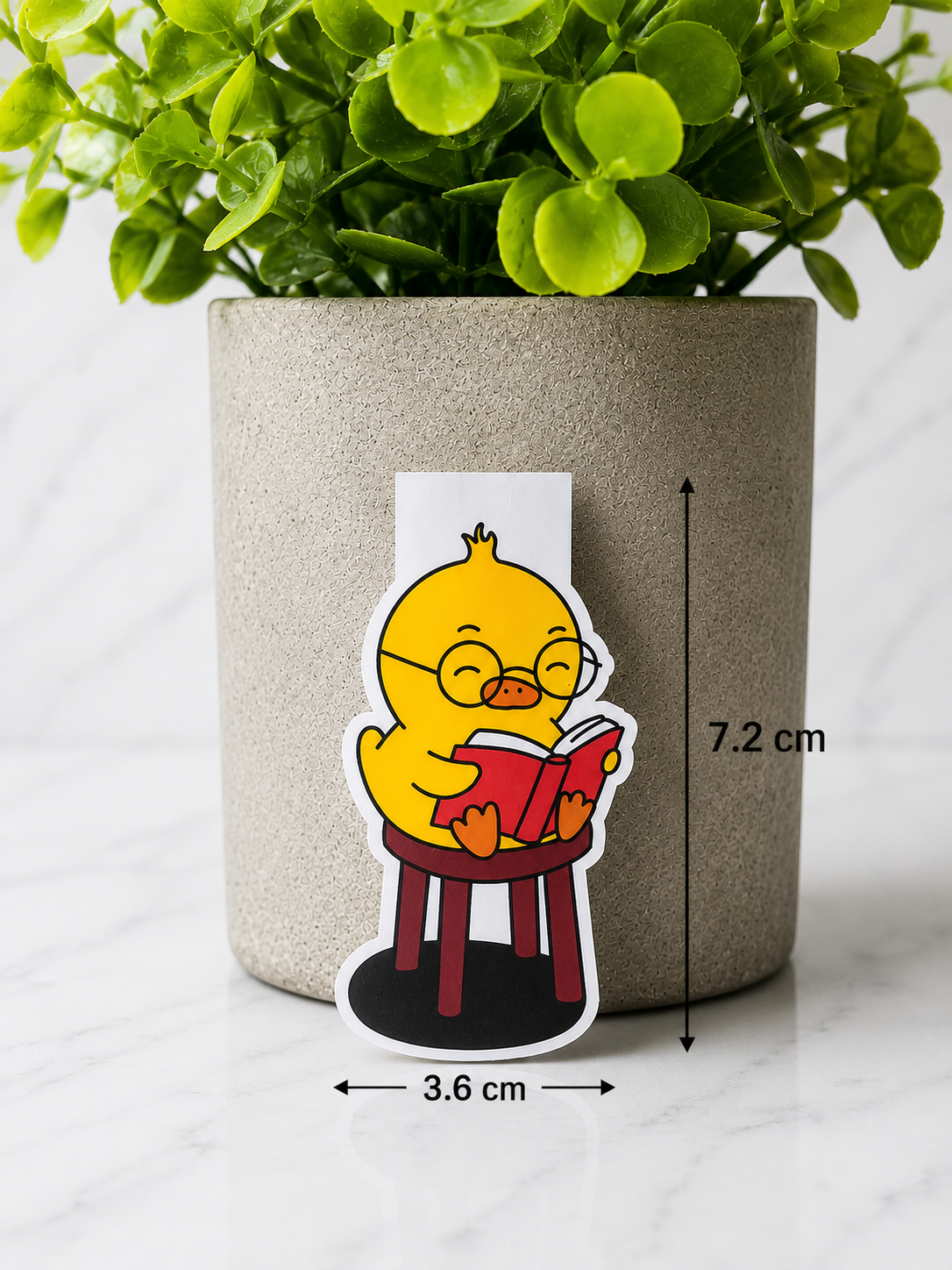 Magnetic bookmark featuring a cute yellow chick reading a book with size 7.2 cm by 3.6 cm
