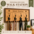 Wooden walk station with hooks for dog leashes and collars, featuring personalised names.