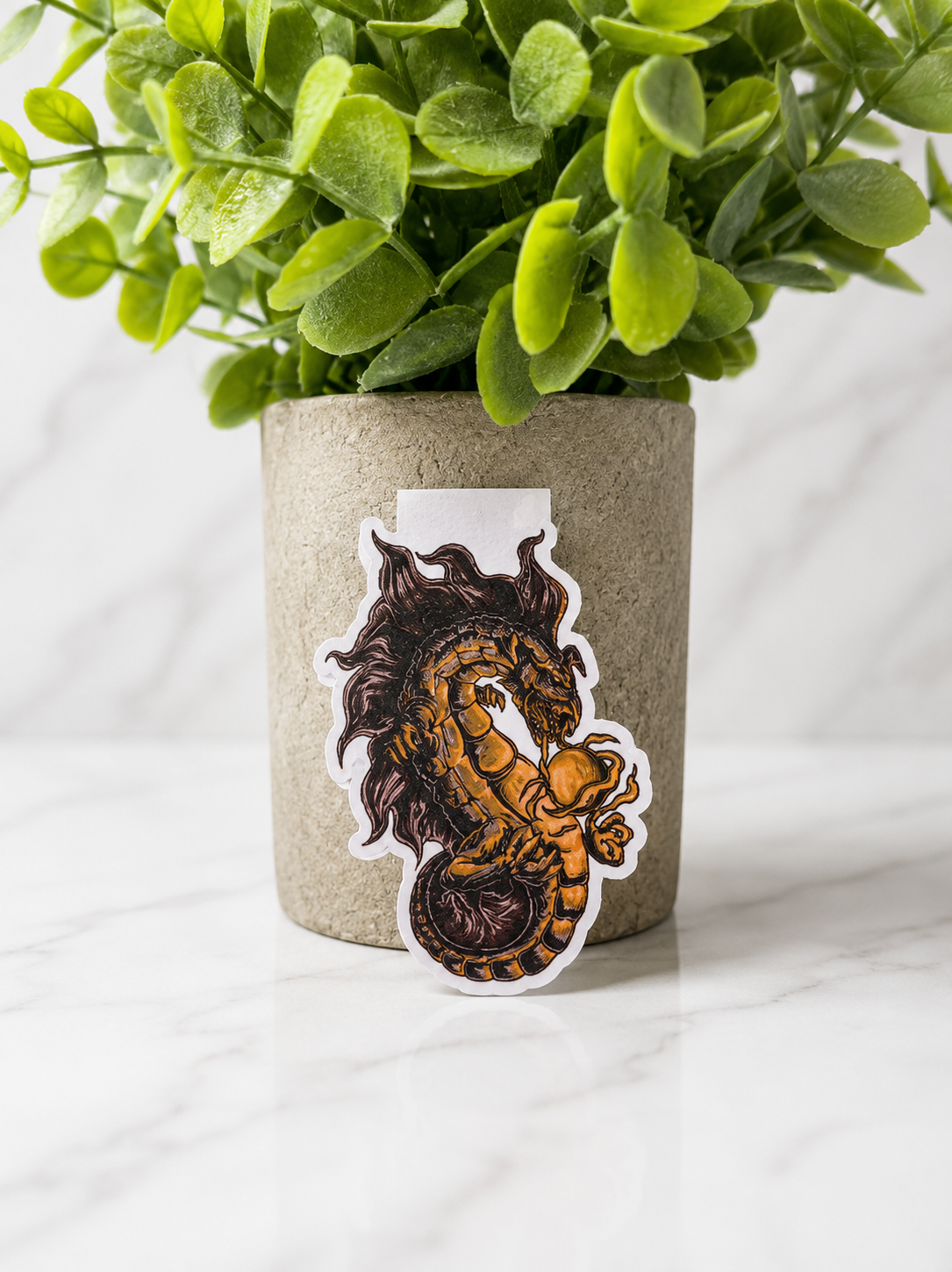 Magnetic bookmark featuring a detailed gold and bronze dragon with an orb and smoke 