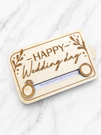 Angled view of wooden wedding gift card holder with ring detail and engraved lettering