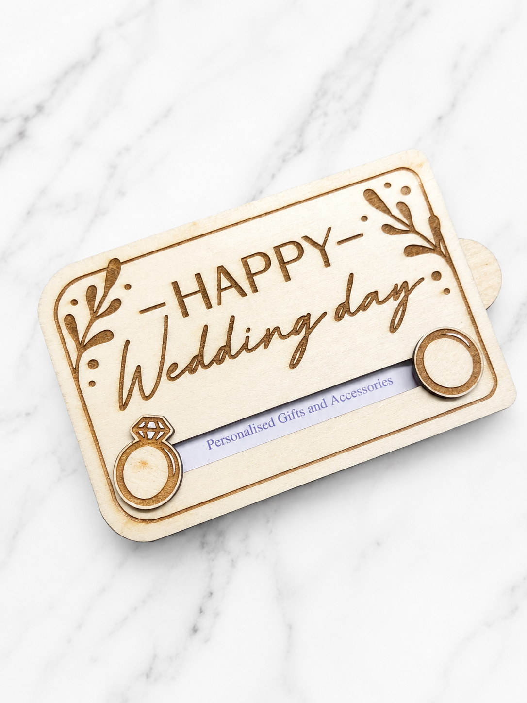 Angled view of wooden wedding gift card holder with ring detail and engraved lettering