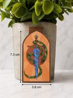 Magnetic bookmark featuring a sword with a green snake wrapped around it shown with measurements 7.3 cm by 3.8 cm