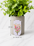 Floral magnetic bookmark with wildflower design showing size 6.9cm by 3.6cm