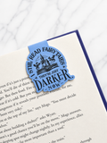Close up of magnetic bookmark with gothic fairytale quote on open book page