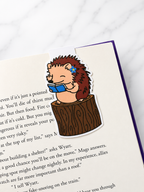 Cute hedgehog magnetic bookmark clipped onto a book page showing use as a page holder