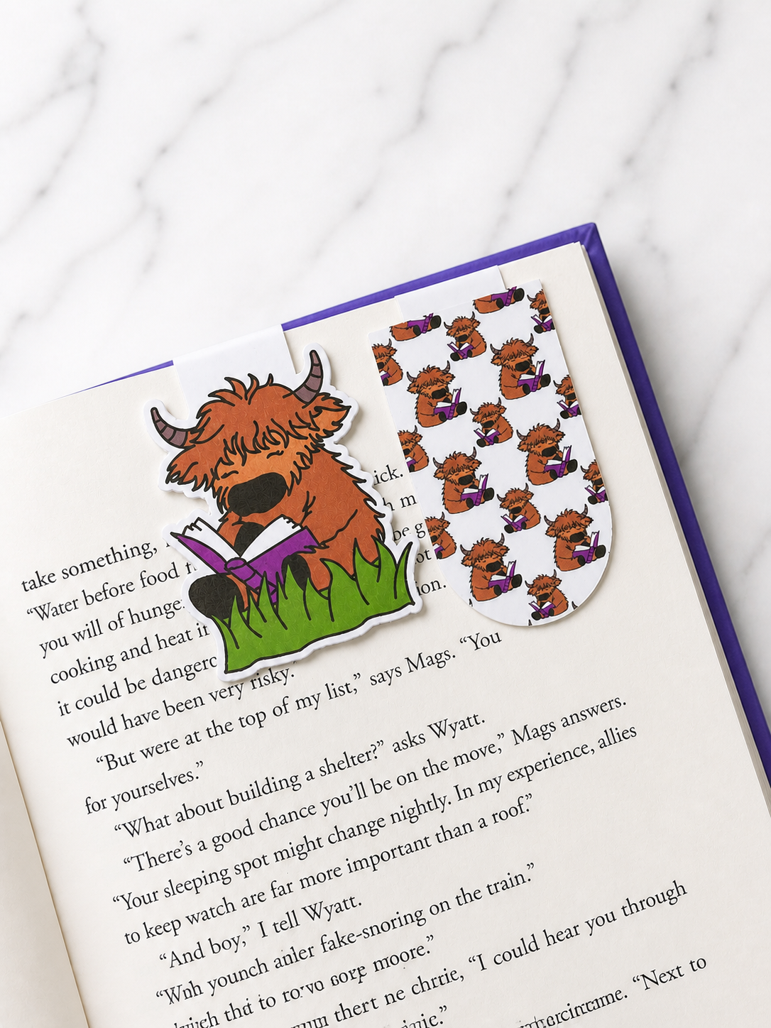 Pattern Highland cow magnetic bookmarks duo set clipped onto a book page demonstrating practical use and secure page marking