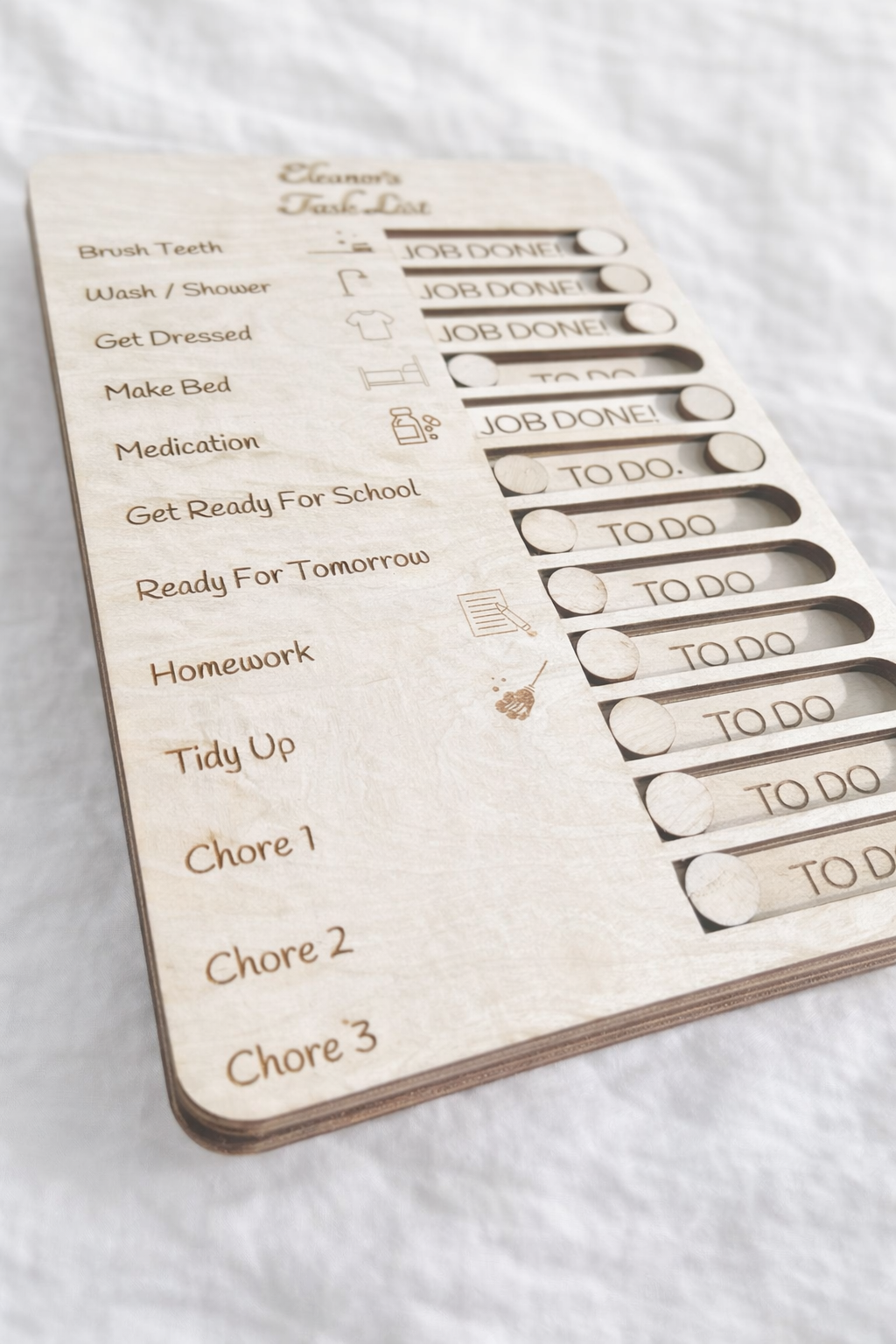 Personalised kids chore chart wooden board with sliders, showing close up, children’s daily routine organiser gift displayed on white surface