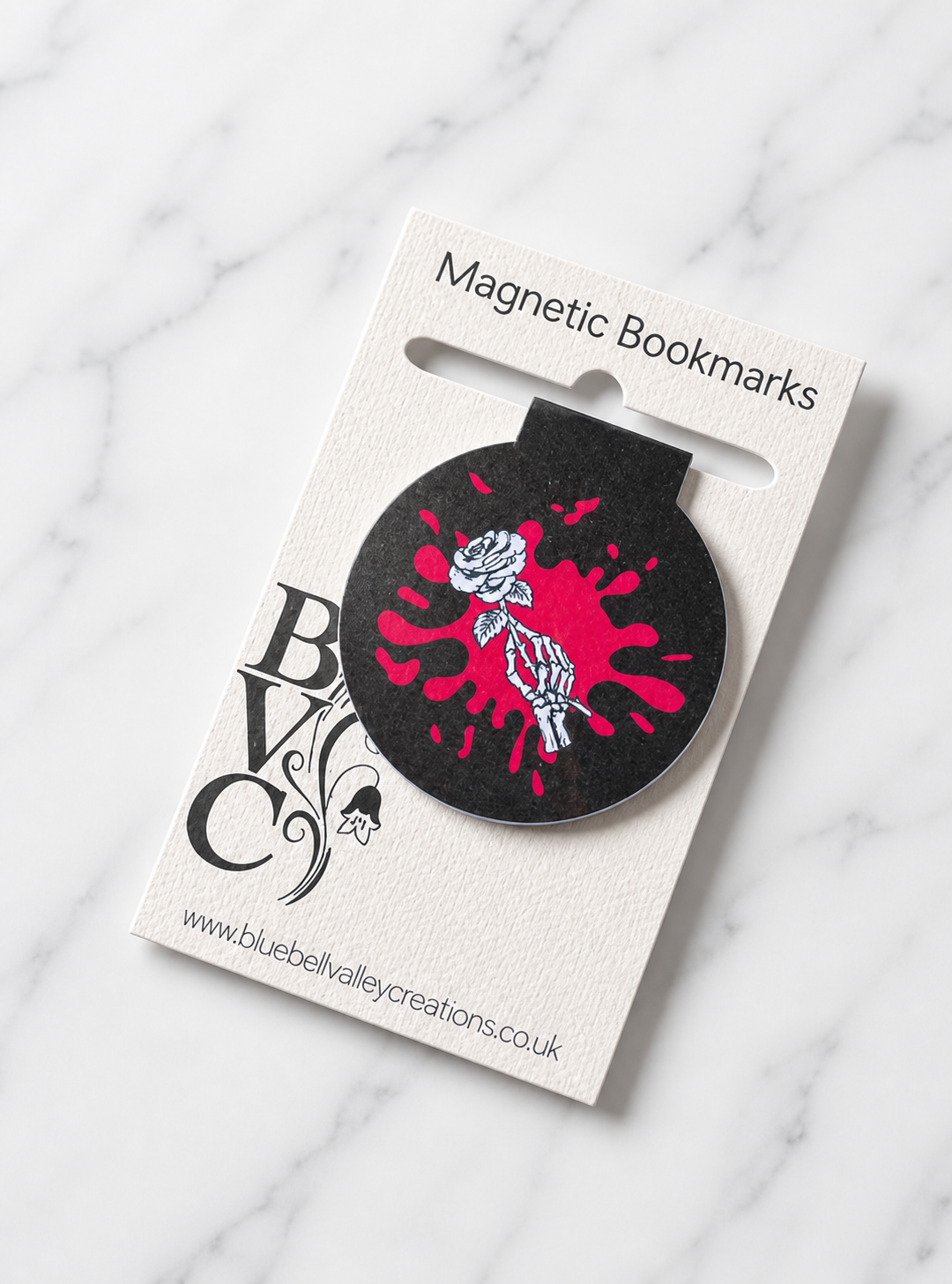 Black gothic magnetic bookmark displayed on branded backing card ready for gifting