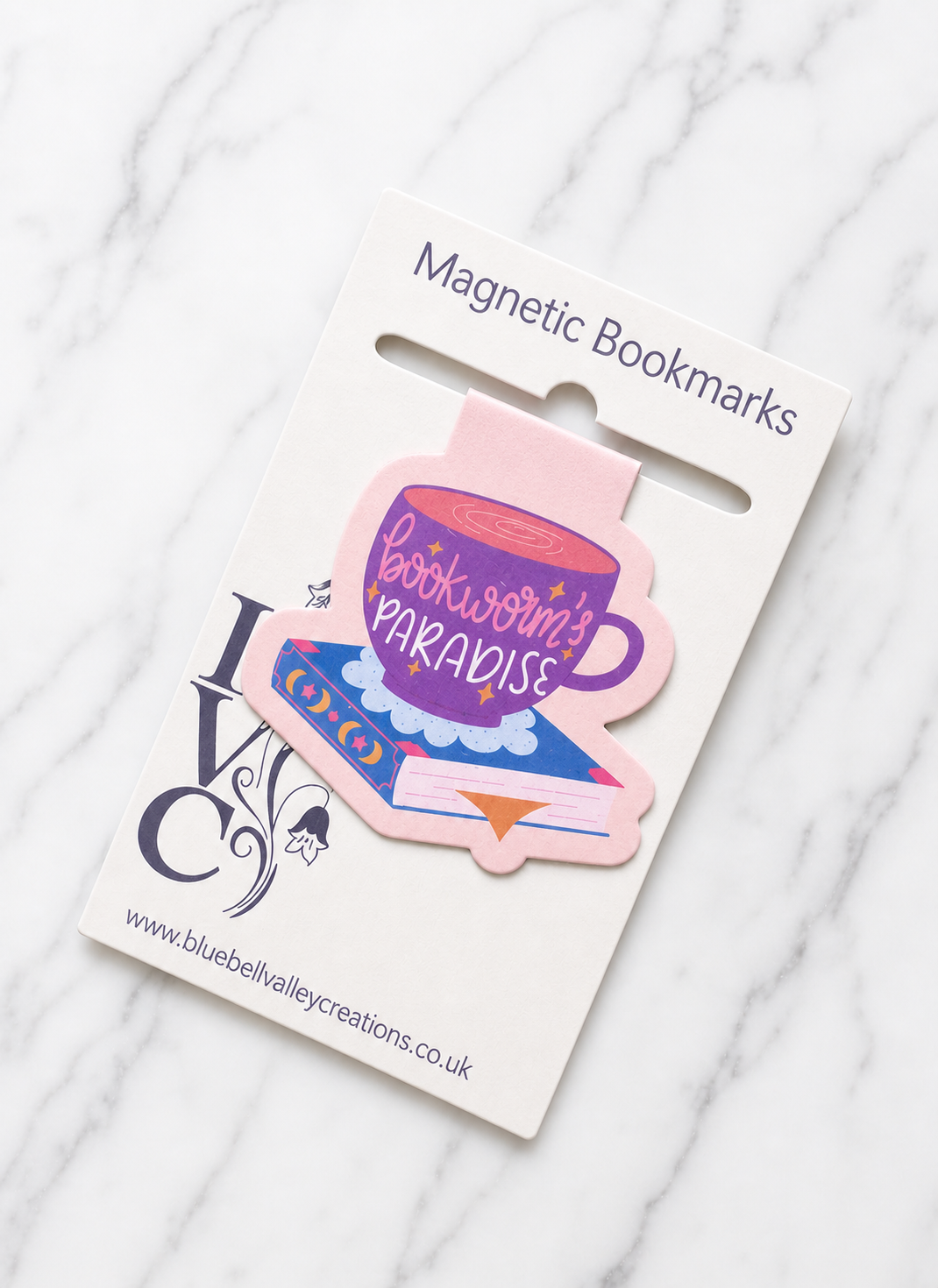 Cute bookworm magnetic bookmark displayed on backing card ready for gifting
