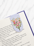 Floral magnetic bookmark clipped onto book page showing slim and secure fit
