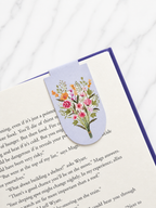Floral magnetic bookmark clipped onto book page showing slim and secure fit