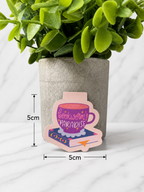 Purple magnetic bookmark with bookworm paradise coffee cup design showing size 5cm by 5cm