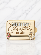 Wooden Merry Christmas gift card holder with engraved festive design and gingerbread and candy cane details