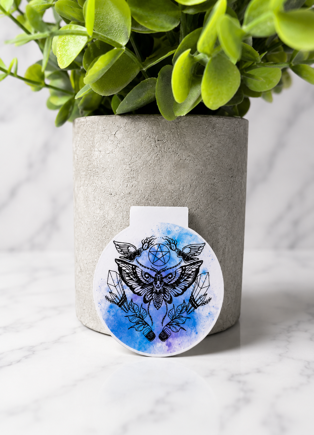 Magnetic bookmark with detailed moth, crystal and pentagram design on blue watercolour background