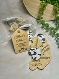 Heart shaped wooden mum tokens with black and white floral backing.