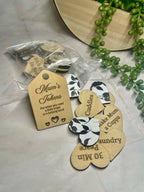 Heart shaped wooden mum tokens with black and white floral backing.