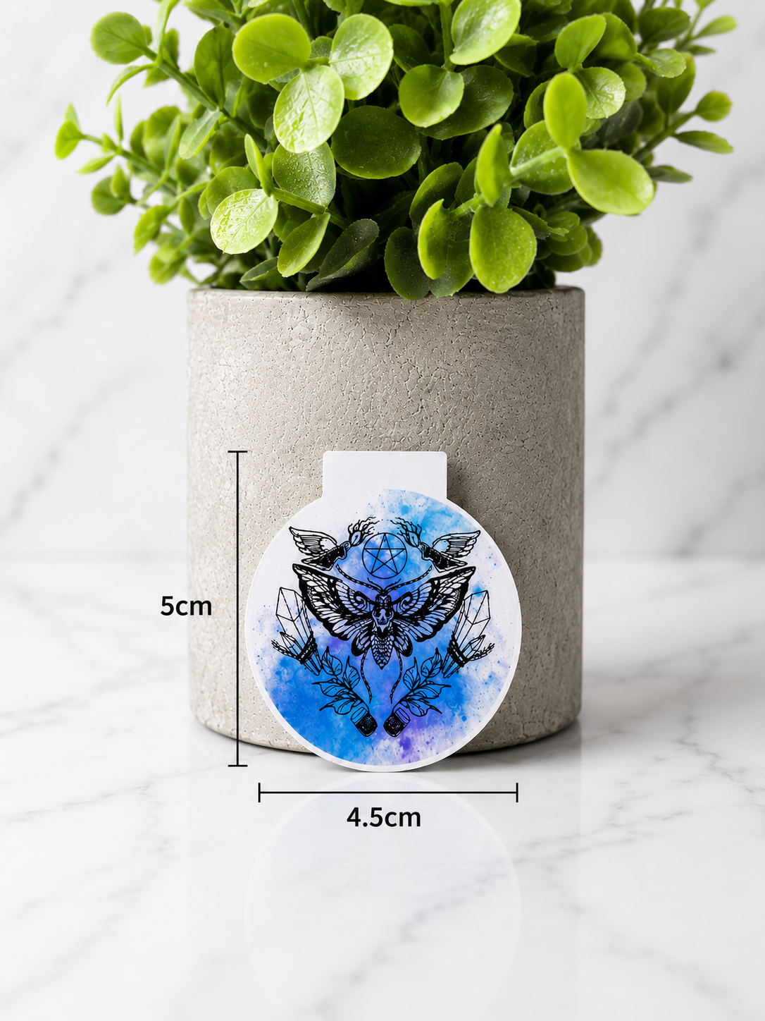 Round magnetic bookmark featuring a moth with crystals and pentagram design shown with measurements 5 cm by 4.5 cm