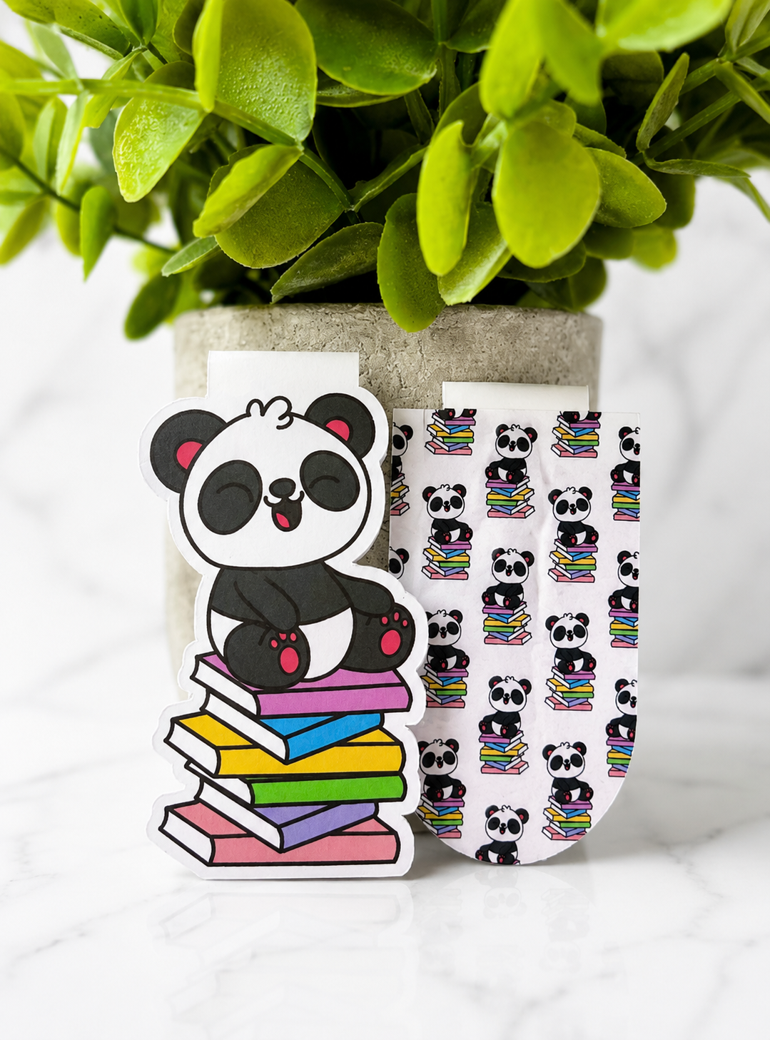 Set of two magnetic bookmarks featuring a panda sitting on books design and matching pattern version displayed together