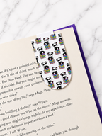 Pattern panda magnetic bookmark clipped onto a book page showing practical everyday use for readers