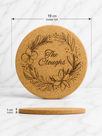 Round personalised cork trivet with engraved floral wreath design showing 19cm diameter and 1cm thickness