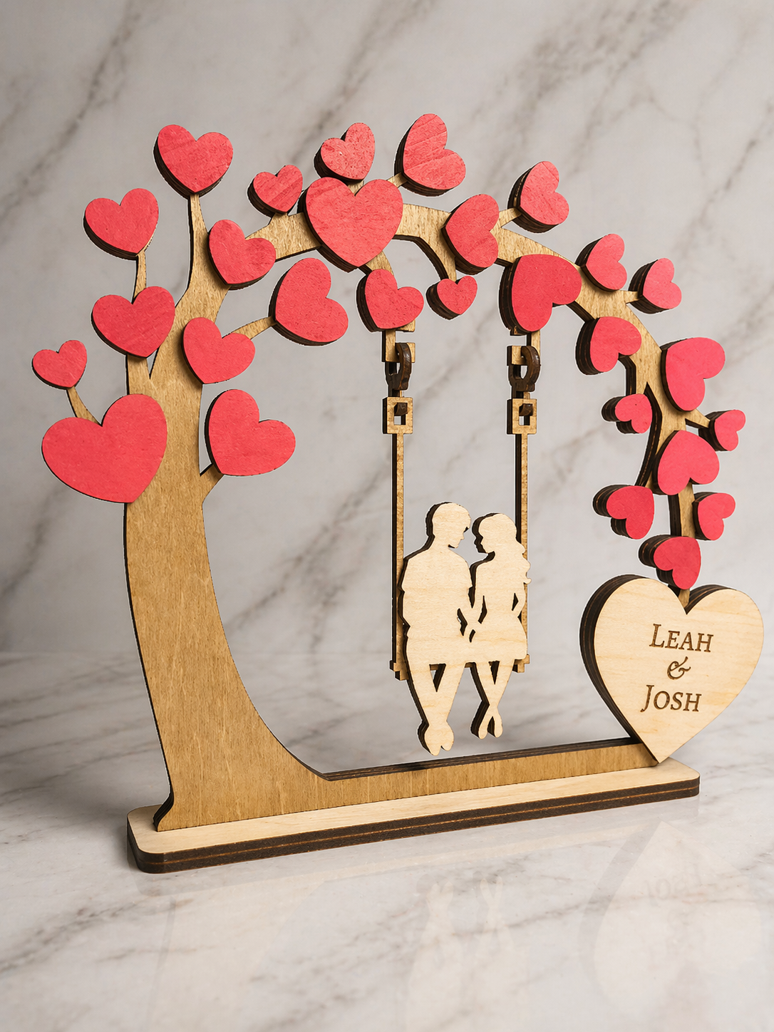 Wooden couple tree swing ornament with red heart leaves and engraved name heart detail