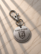 Engraved metal keychain with Class of 2026 text on marble background, personalised school leaver gift