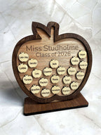 Front view of personalised wooden apple plaque engraved with teacher name and student names, classroom gift idea