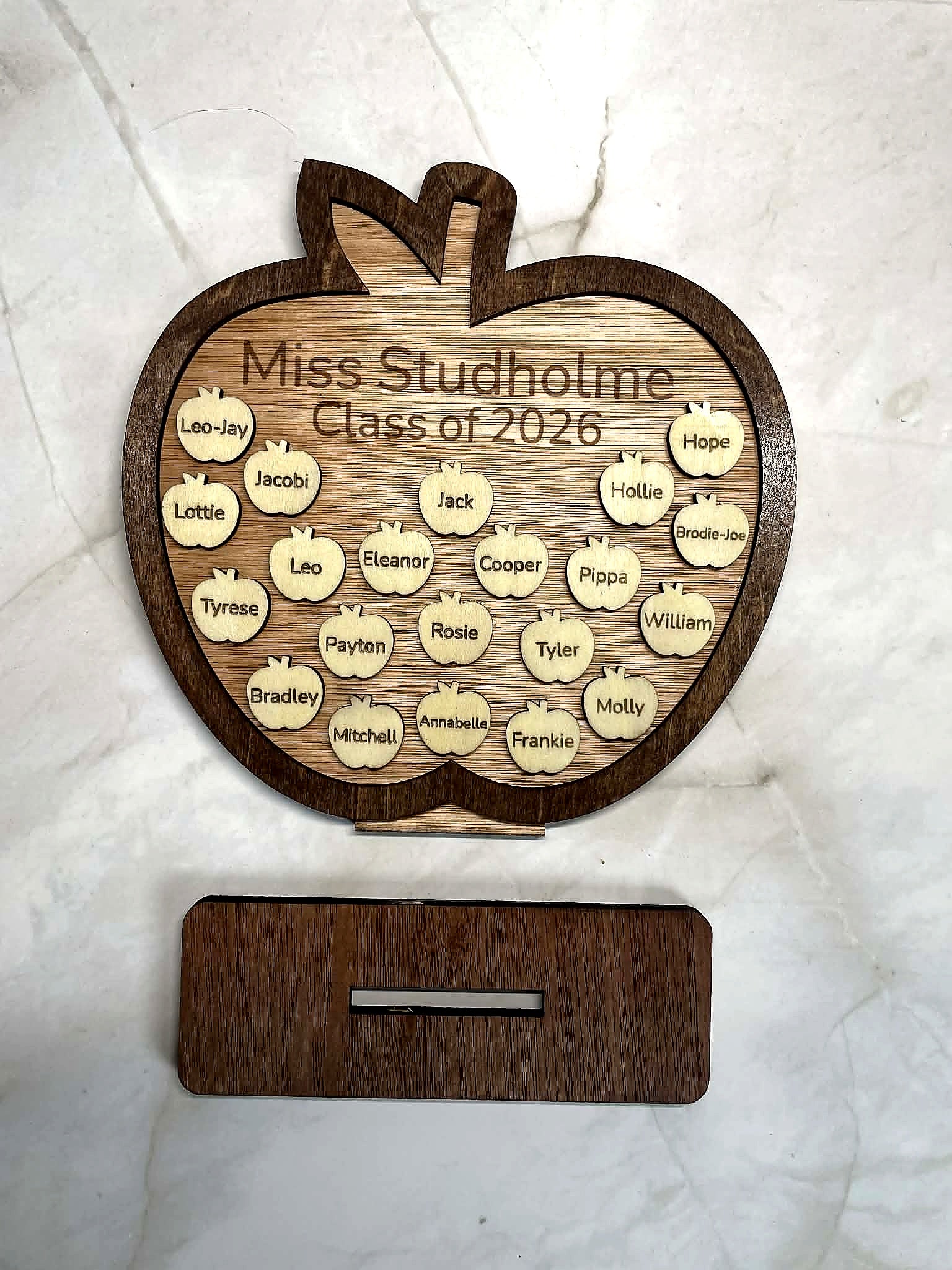 Engraved wooden apple plaque with detachable stand showing teacher name and class of 2026 with student names