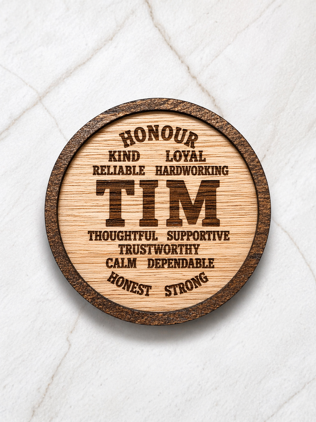 Engraved wooden coaster showing the name Tim with meaningful words, personalised gift for him on marble background