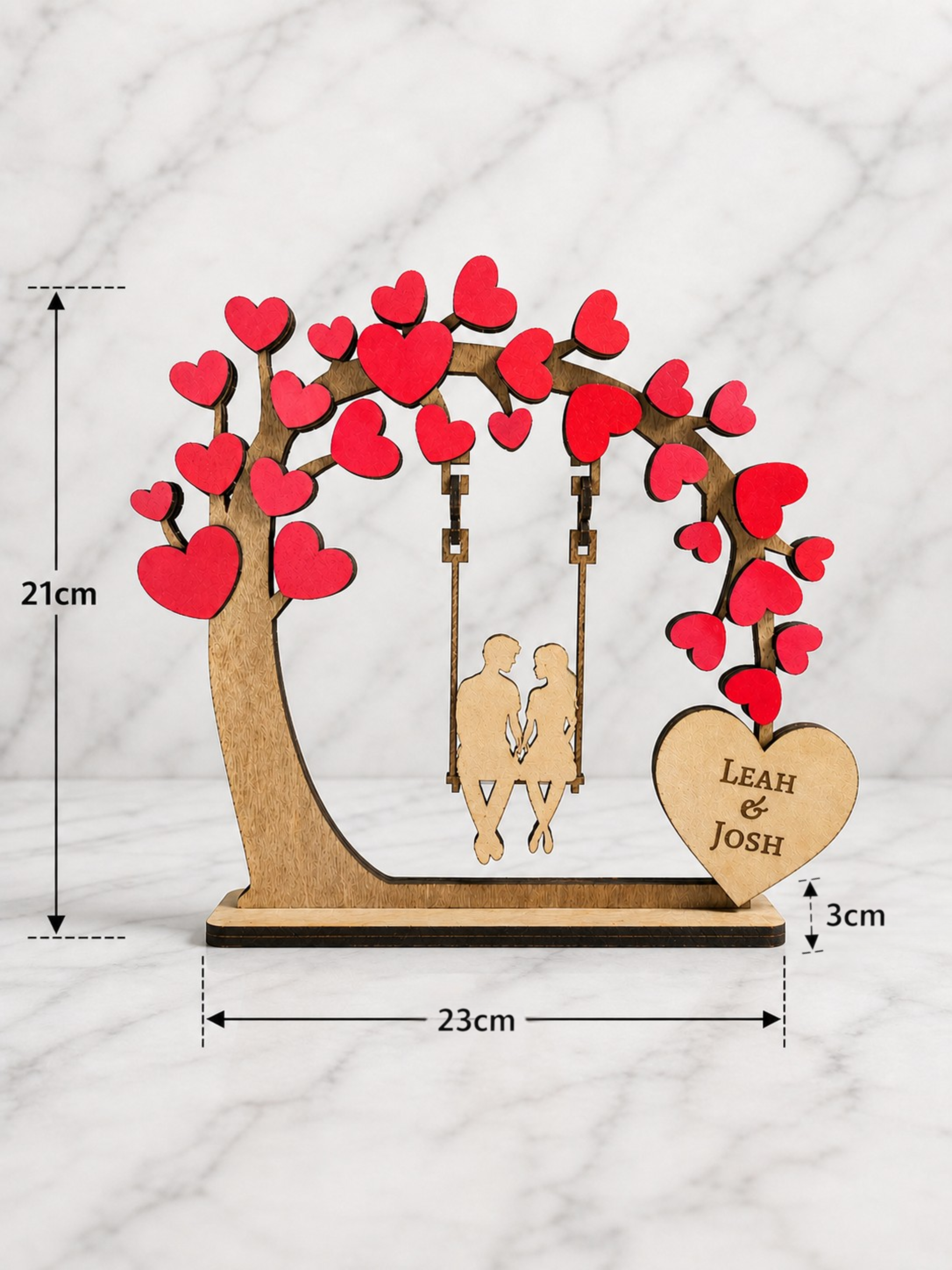 Personalised wooden couple tree swing ornament with heart design showing 23cm width and 21cm height dimensions