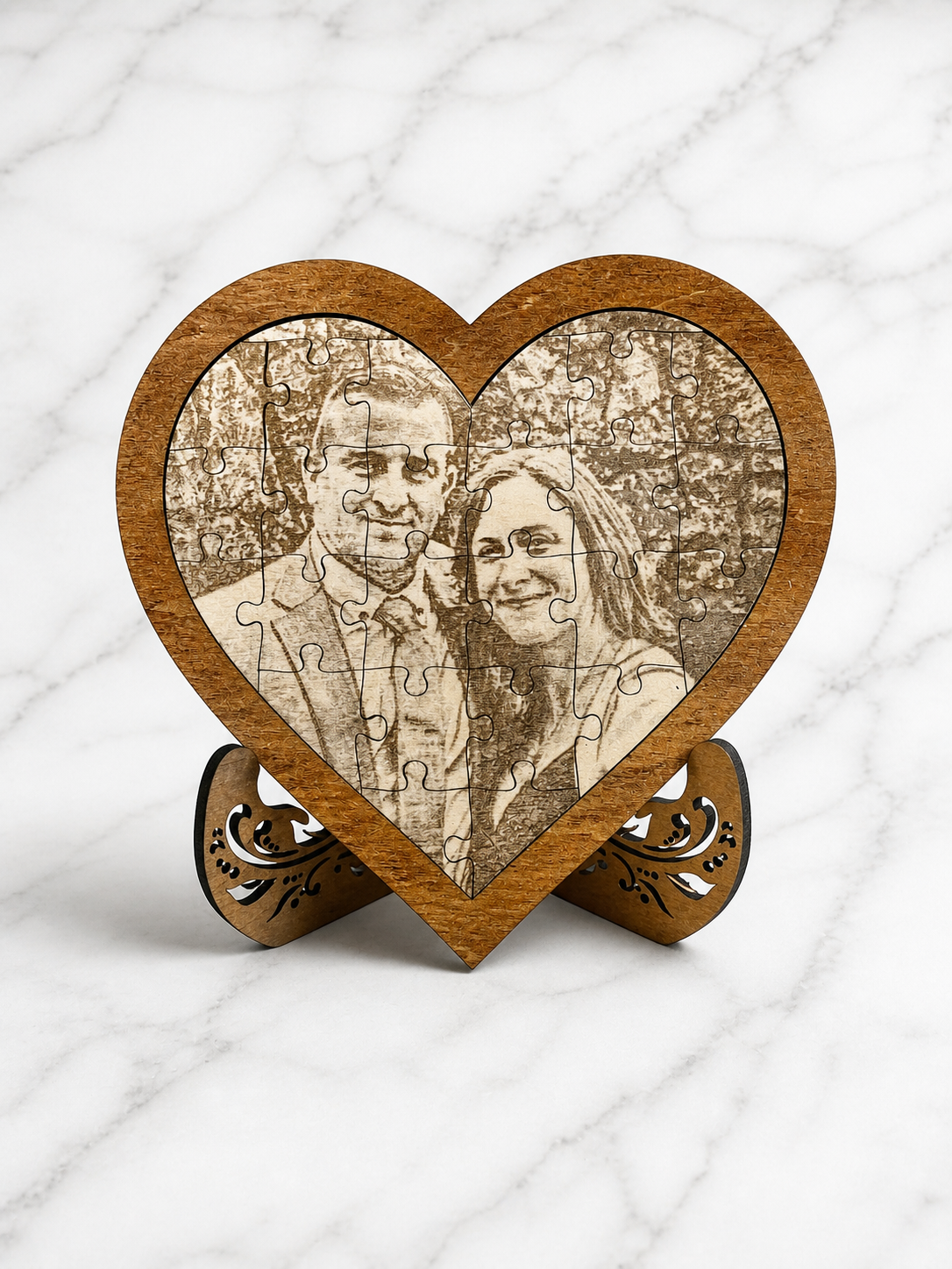 Custom engraved wooden heart puzzle with couple photo displayed on decorative stand
