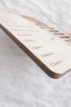 Personalised kids chore chart wooden board with sliders, showing side of the wood, children’s daily routine organiser gift displayed on white surface