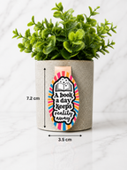 Magnetic bookmark with reading quote shown with measurements 7.2 cm by 3.5 cm