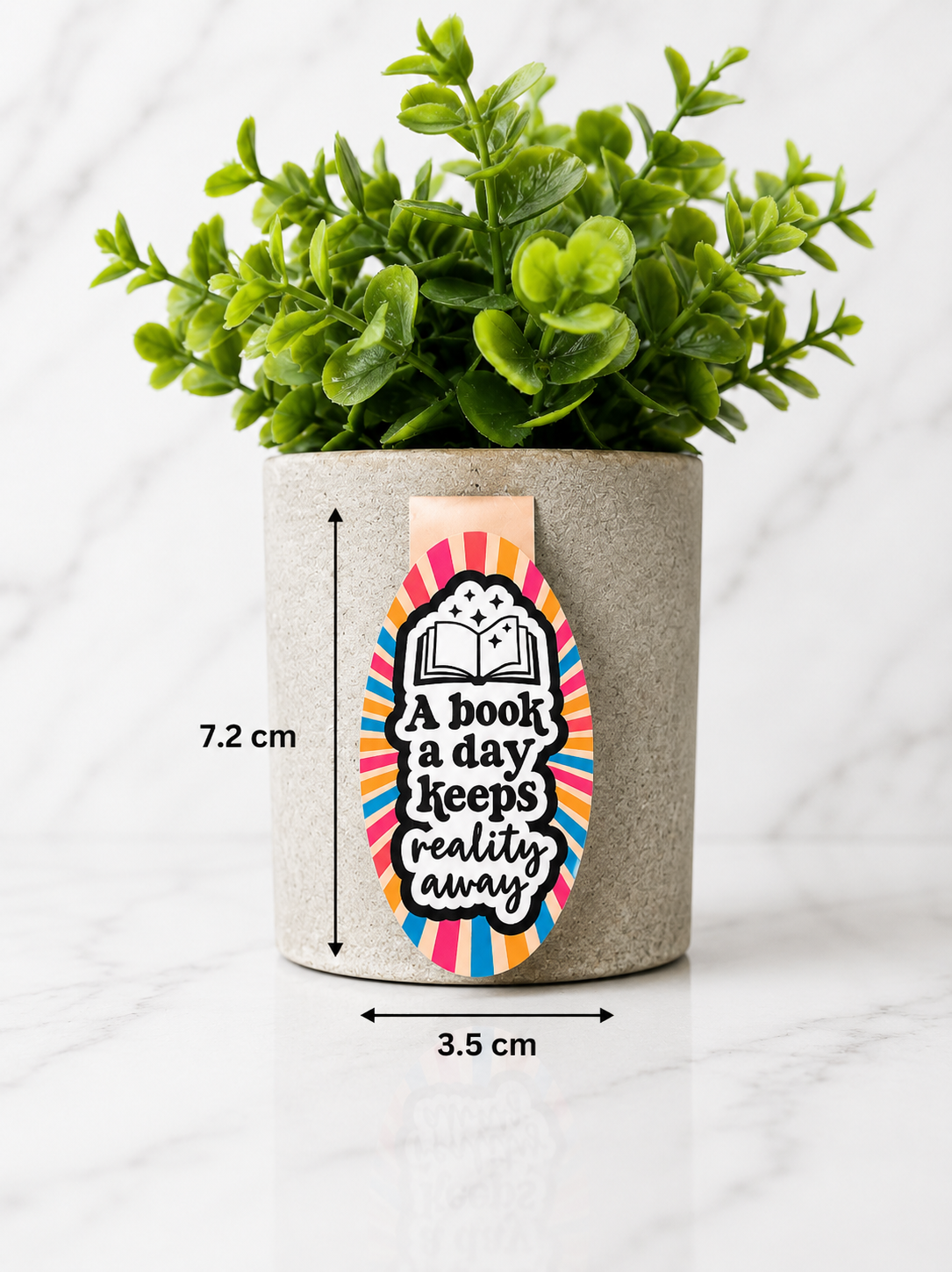 Magnetic bookmark with reading quote shown with measurements 7.2 cm by 3.5 cm