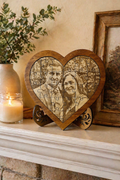 Personalised wooden heart photo puzzle displayed on table in cosy home setting romantic gift idea