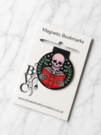 Skeleton reading magnetic bookmark displayed on Bluebell Valley Creations branded packaging on a marble background