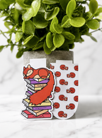 Two magnetic bookmarks featuring a sleeping squirrel character and matching pattern design displayed together