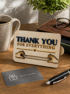 Wooden engraved gift card holder displayed on desk with coffee, pen and gift card as a thoughtful thank you gift