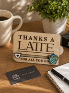 Wooden thanks a latte gift card holder displayed on desk with coffee mug and stationery