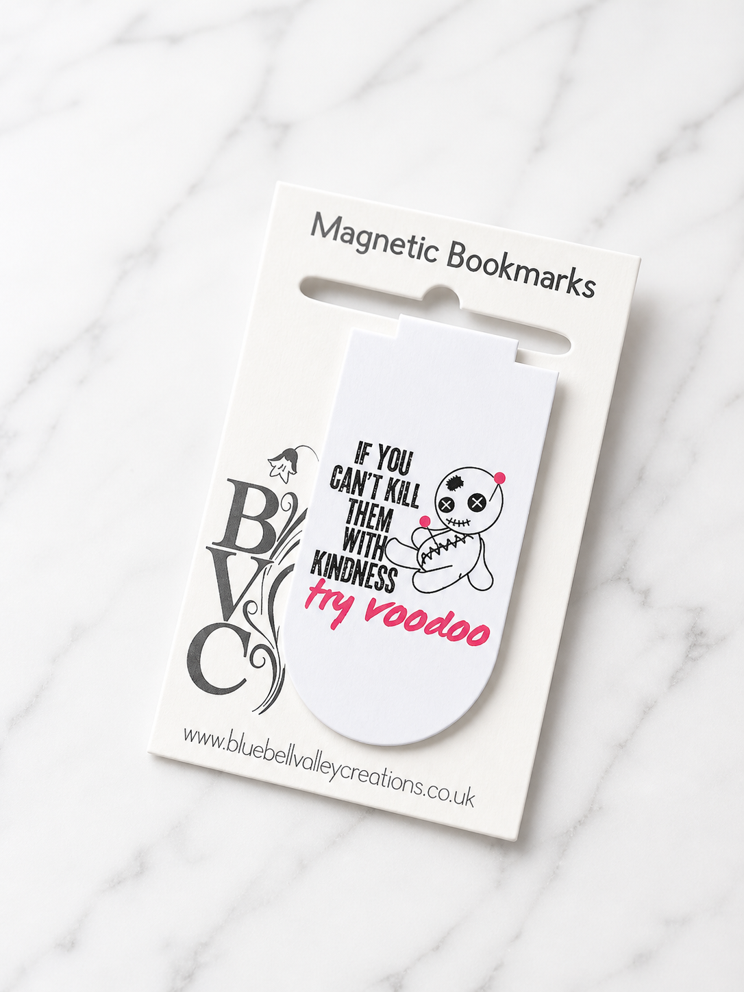 Voodoo doll magnetic bookmark with sarcastic quote displayed on Bluebell Valley Creations branded packaging against a clean marble background