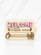 Laser engraved wooden baby gift card holder with welcome little one text and baby themed icons