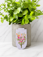 Magnetic bookmark with delicate wildflower illustration on soft pastel background