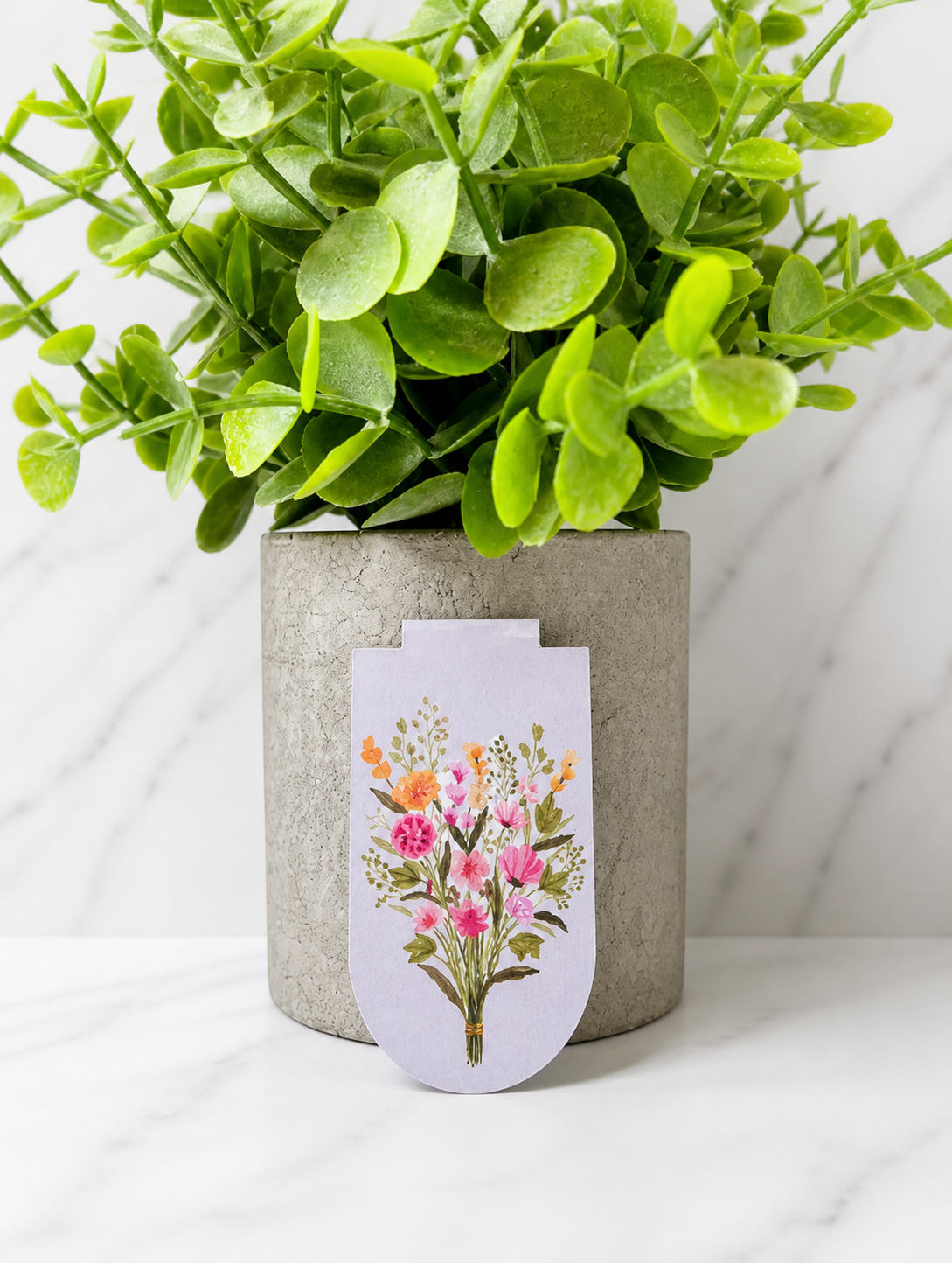 Magnetic bookmark with delicate wildflower illustration on soft pastel background