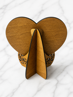 Back view of personalised wooden heart puzzle showing slot-in display stand and wood finish